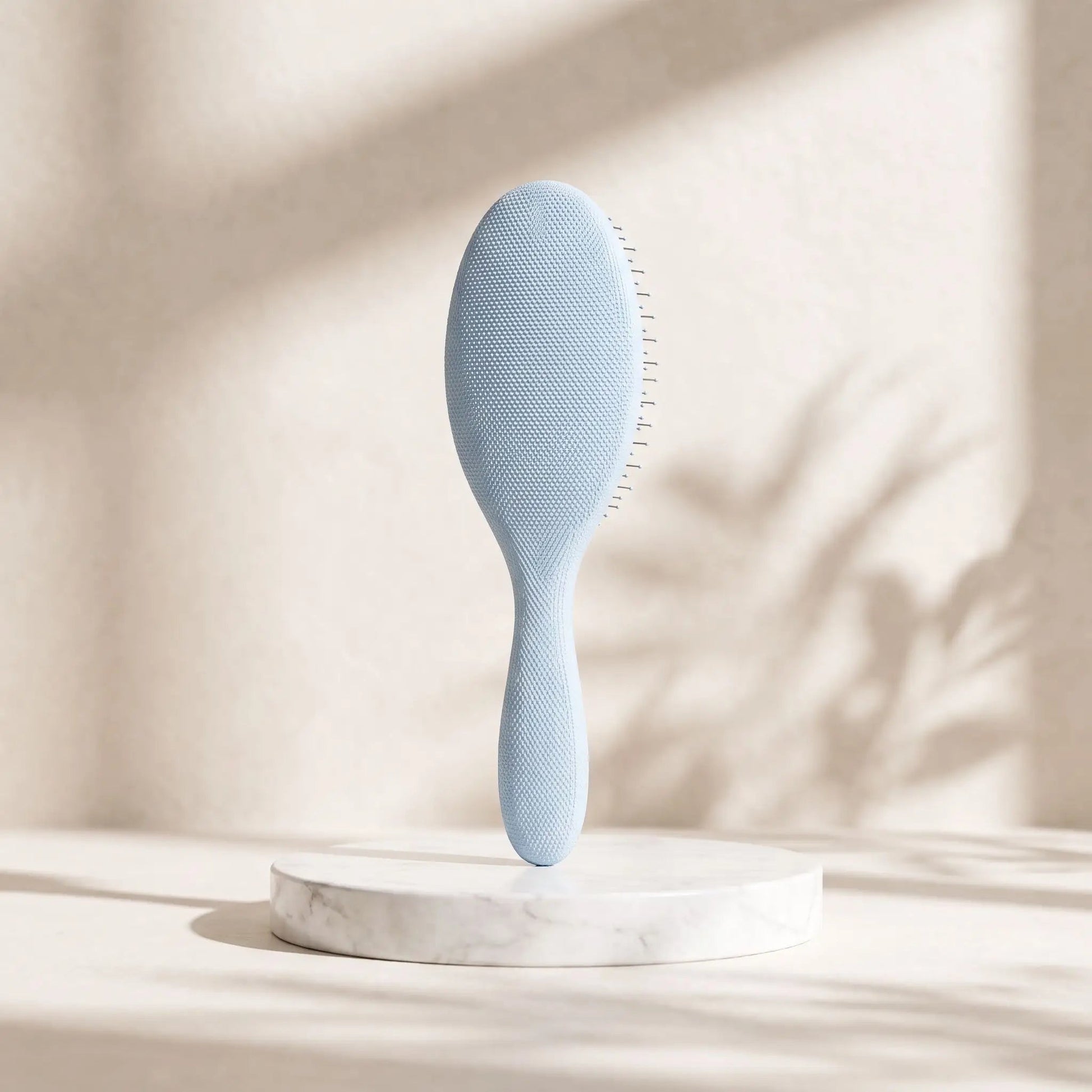 Brosse-cheveux-boucles-et-lisses-demelage-magique-en-spirale-couleur-gris.